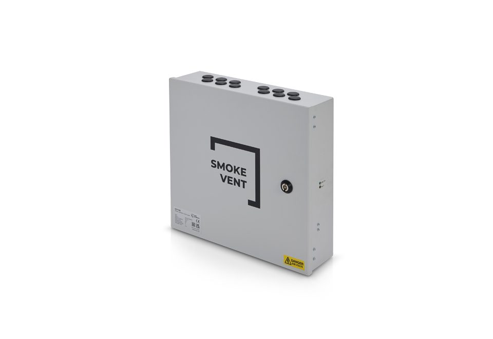 A gray rectangular smoke vent control box with multiple cable entry points on the top and a lockable access panel on the front labeled "SMOKE VENT" integrates seamlessly into natural ventilation systems, efficiently managing window actuators.