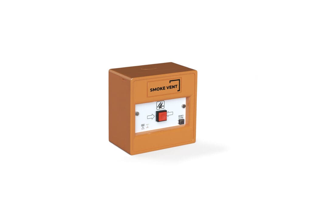 An orange smoke vent control box with a red button and a label indicating "SMOKE VENT" ensures efficient smoke ventilation in emergency situations.