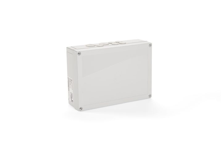 A rectangular, gray plastic electrical junction box with screw-on corners, featuring four circular knockouts on the top edge, suitable for integrating door automation systems.