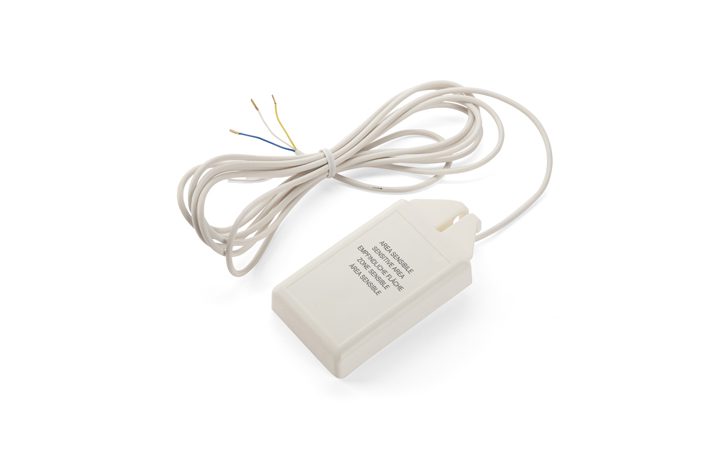 A white plastic electrical device with a long cord and exposed wires at the end, designed for natural ventilation. There is text printed on the surface of the device.