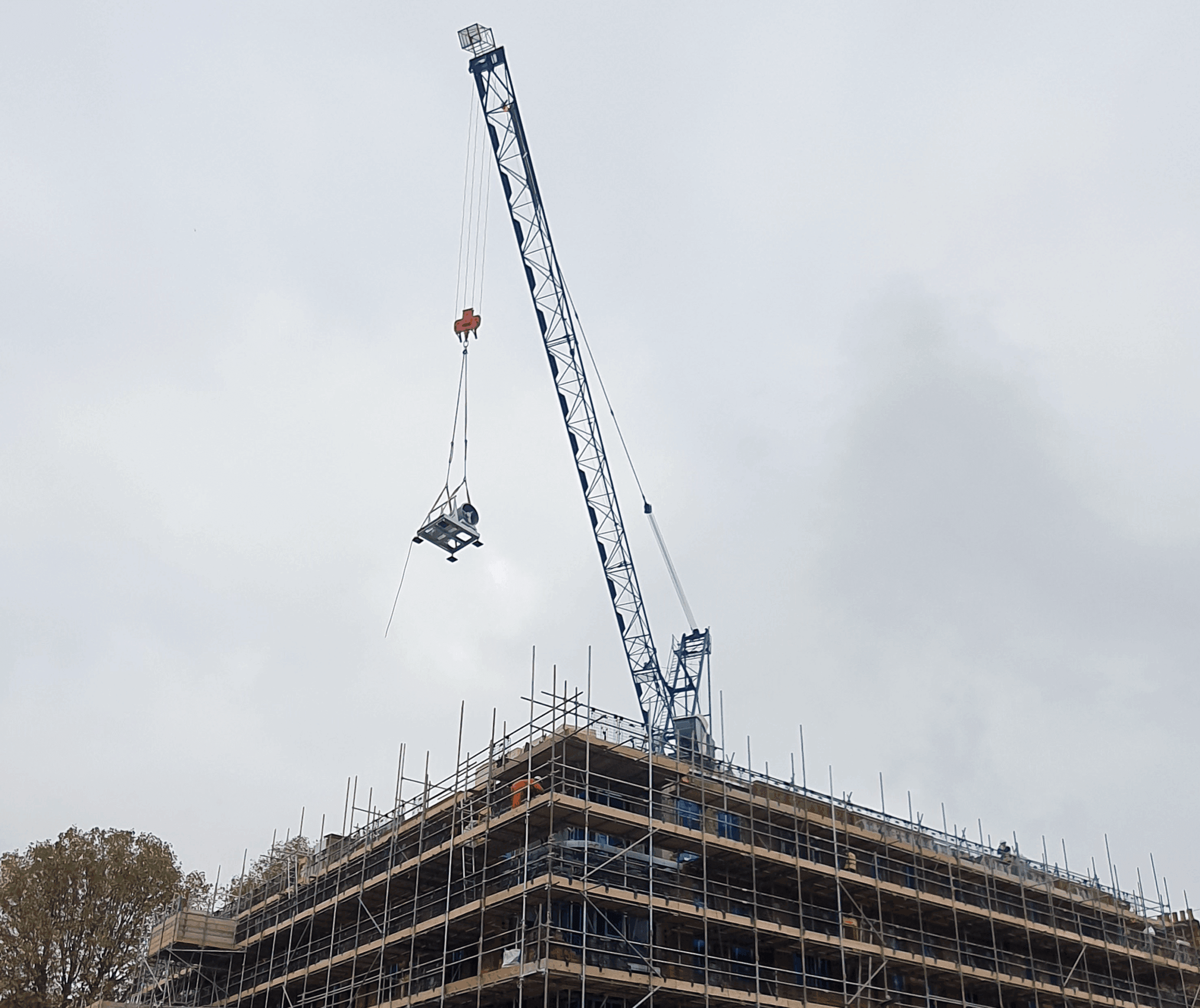 Smoke Ventilation Fan Being Lifted Onto Building